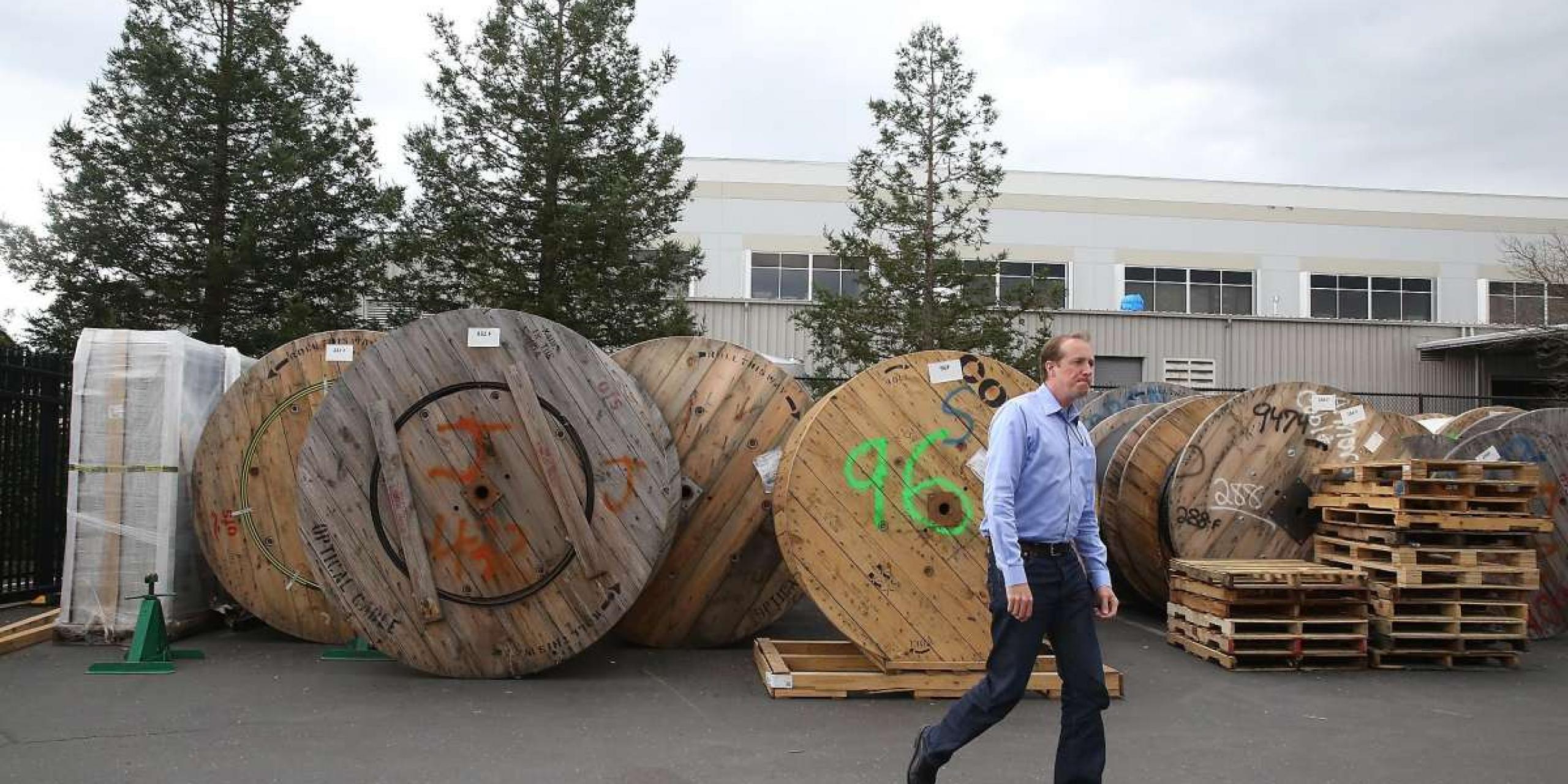 Dane Jasper standing next to fiber cable