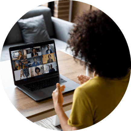 Woman talking to some colleagues in an online business meeting while working at home